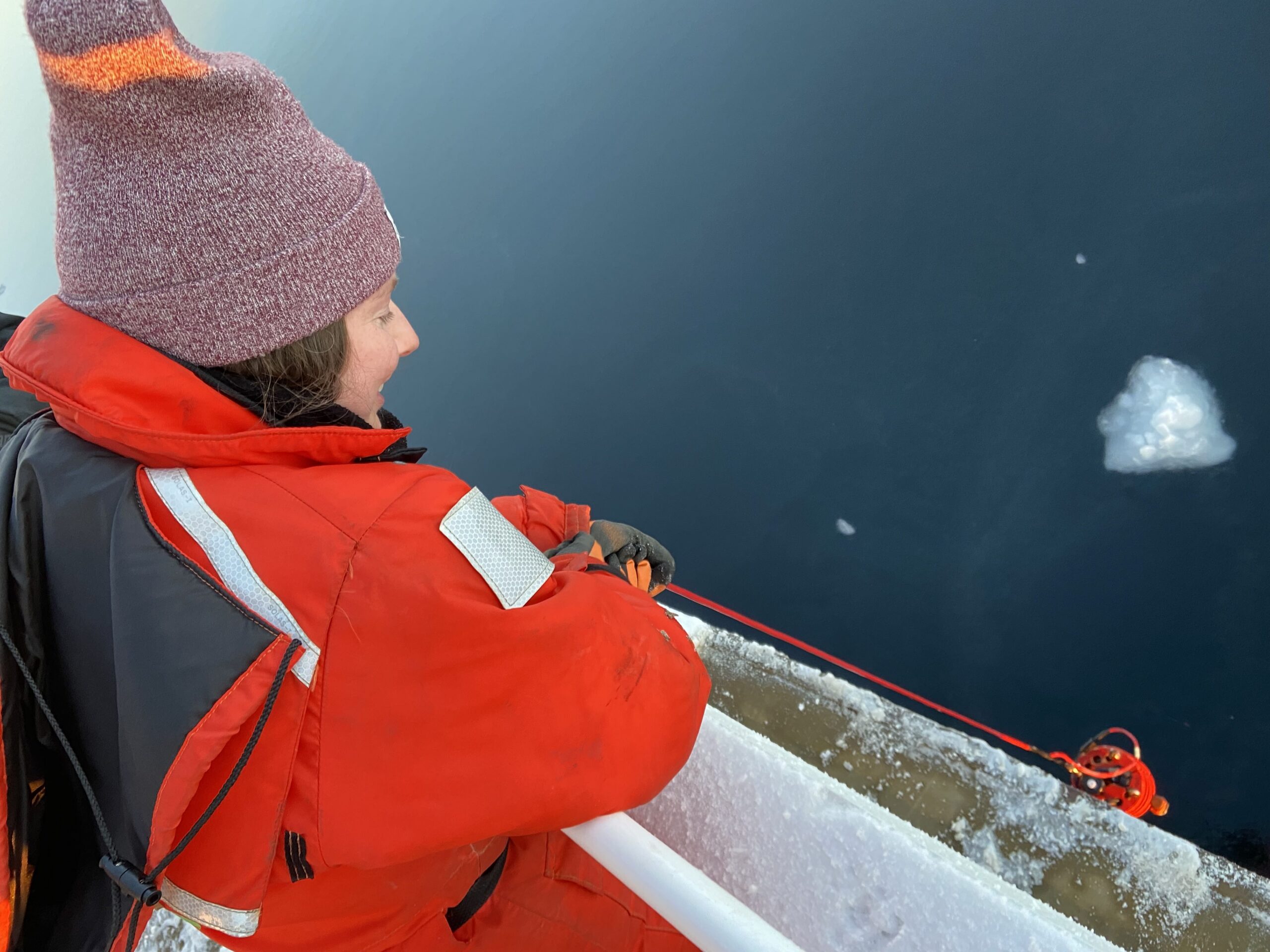 Dr. Clare Gaffey collecting upper ocean optics as part of the U.S. Synoptic Arctic Survey research cruise. Photo by Dr. Seth Danielson.