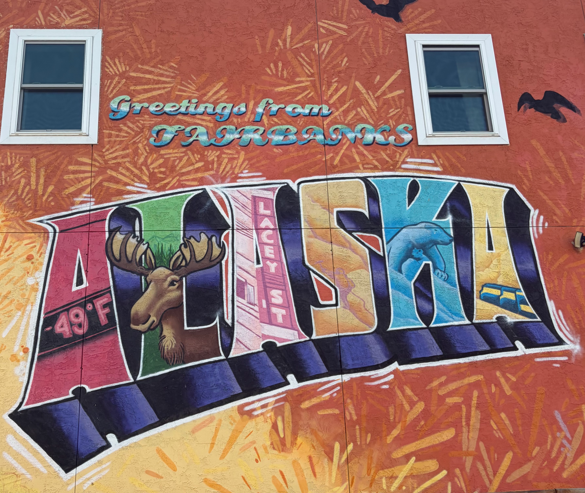 Mural in Fairbanks, Alaska that says Greetings from Fairbanks Alaska.